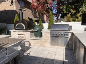 Outdoor kitchen with smoker, grill, and pizza oven northbrook, il